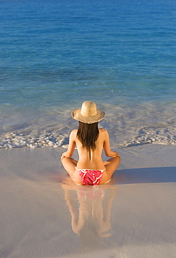 Woman sitting on beach