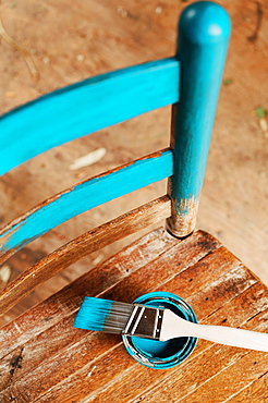 Old wooden chair with turquoise paint