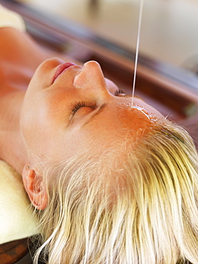 Woman getting aromatherapy in spa