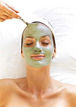 Woman receiving face spa therapy