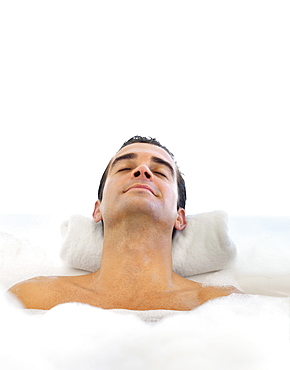 Man relaxing in bathtub