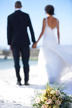 Newlywed couple on beach