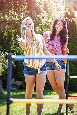 Portrait of young women throwing balls, USA, Washington, Bellingham 