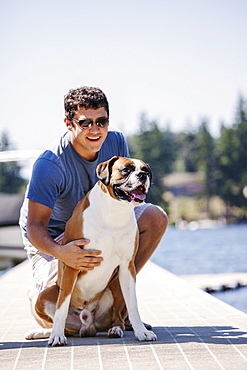 Portrait of young man posing with his dog, USA, Washington, Bellingham 