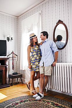 Young couple in hotel room