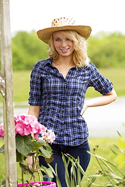 Portrait of young woman in garden, USA, New Jersey, Old Wick 