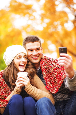 Portrait of couple in Central Park taking photo of themselves, USA, New York State, New York City