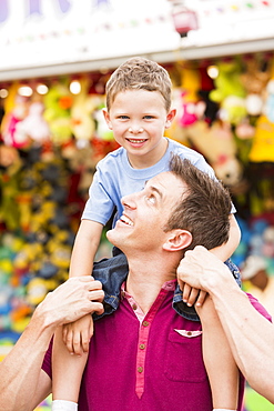 Happy father with son (4-5) in amusement park, USA, Utah, Salt Lake City 