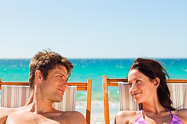 Close-up of lovers taking a sunbath