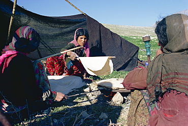 Qashqai women making bread in camp, southern area, Iran, Middle East