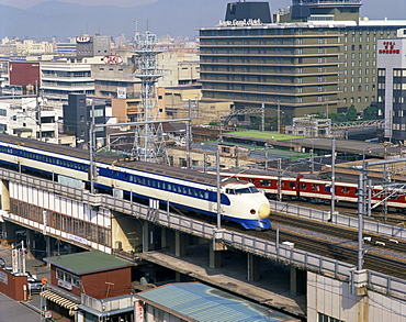 The bullet train passing the Grand Hotel in Kyoto, Japan, Asia