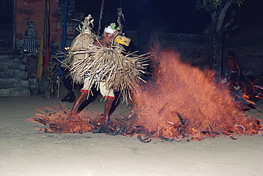 A dancer with an animal mask in a trance performing the fire dance on Bali, Indonesia, Southeast Asia, Asia