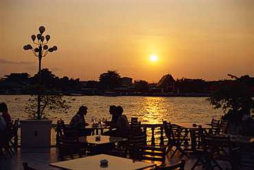 Sunset over the Chao Phya River from the terrace of the Oriental Hotel, Bangkok, Thailand, Southeast Asia, Asia