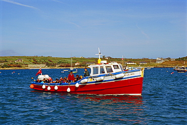 Tourists on boat, Scilly Isles, UK, Europe