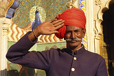 Guard in turban saluting at City Palace, Jaipur, Rajasthan state, India, Asia