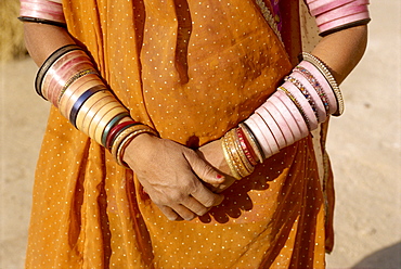 Bangles cover a woman's arms, Rajasthan state, India, Asia