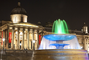 The National Gallery and fountain in Trafalgar Square at night, London, England, United Kingdom, Europe