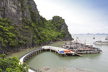 A boat docking station at one of the many isalnds in Ha Long Bay, UNESCO World Heritage Site, Vietnam, Indochina, Southeast Asia, Asia