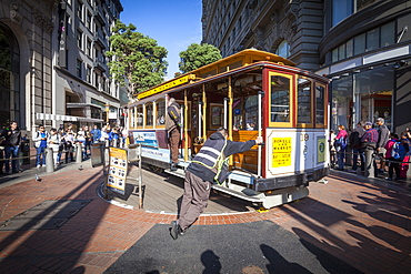 Powell-Hyde Cable Car being turned by brakemen, San Francisco, California, United States of America, North America