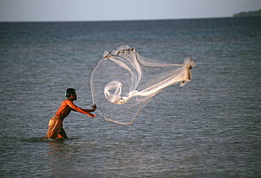 Fisherman throws net.Truk Lagoon