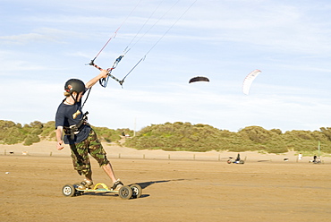 Power kite boarding on Weston-Super-Mare beach, UK