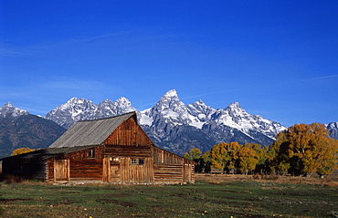 Traditional barn and Teton Mountain range, Grand Teton National Park, Wyoming, USA