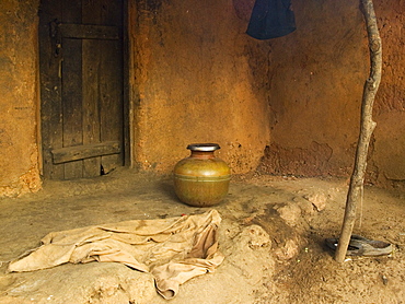 Water pale outside mud-built farmhouse, Gokarna, Karnataka, India