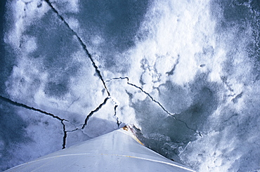 Ships bow breaking ice to enter a fjord in the high arctic. Svalbard / Spitsbergen