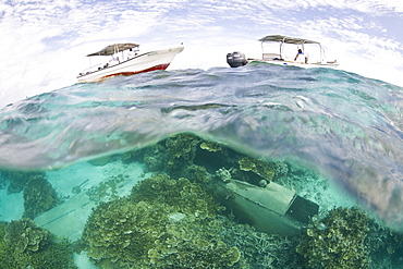 Dive boats over a Japanese plane wreck from WWII.  Yap, Federated States of Micronesia.