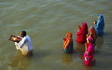 Devotees offering prayer to sun god during "Chat Puja", a religous festival celebrated by the hindus in India,  Kolkata,  India