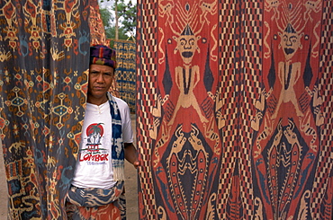 Portrait of a man and ikat design, Sumba (Soemba), Lesser Sundas, Indonesia, Southeast Asia, Asia