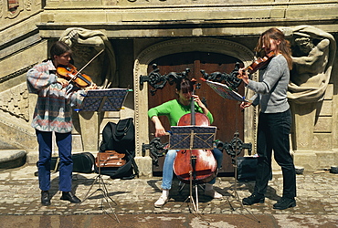 Musicians busking outside Town Hall, Gdansk, Pomerania, Poland, Europe