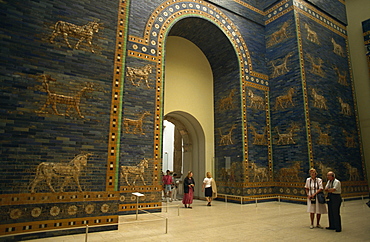 Tourists listen to recorded description of Ishtar Gate, Babylonian dating from the 6th century BC, Pergamon Museum, Berlin, Germany, Europe