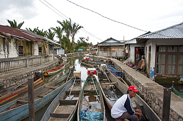 Fishing canoes in a stream leading to Tondano Lake, Sulawesi, Indonesia, Southeast Asia, Asia