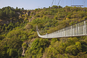 Tourists crossing Swinging Bridge over Khndzoresk Canyon, Khndzoresk, Goris, Armenia, Central Asia, Asia 