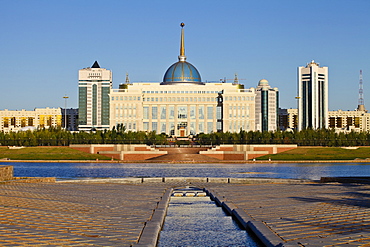 View of The Ak Orda Presidential Palace of President Nursultan Nazarbayev reflecting in Ishim River, Astana, Kazakhstan, Central Asia, Asia