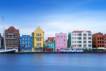 View of St. Anna Bay looking towards colonial merchant houses lining Handelskade along Punda's waterfront, UNESCO World Heritage Site, Willemstad, Curacao, West Indies, Lesser Antilles, former Netherlands Antilles, Caribbean, Central America