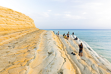 Scala dei Turchi, tourists relaxing at sunset, Rossello Cape, Realmonte, Agrigento, Sicily, Italy, Mediterranean, Europe 