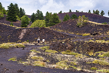 Tourists visiting an old lava flow from an eruption on Mount Etna, UNESCO World Heritage Site, Sicily, Italy, Europe 