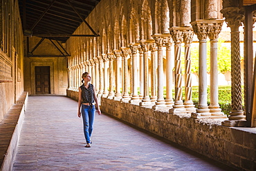 Tourist at Monreale Cathedral (Duomo di Monreale) in courtyard gardens, Monreale, near Palermo, Sicily, Italy, Europe