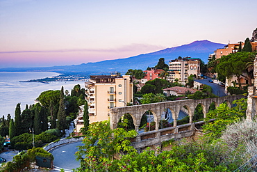 Mount Etna volcano rising above Taormina at sunrise, East Coast of Sicily, Italy, Mediterranean, Europe 