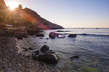 Sunstar at Isola Bella Beach at sunrise, Taormina, Sicily, Italy, Mediterranean, Europe 