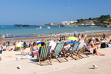 Colourful deck chairs at Swanage Beach, Dorset, England, United Kingdom, Europe