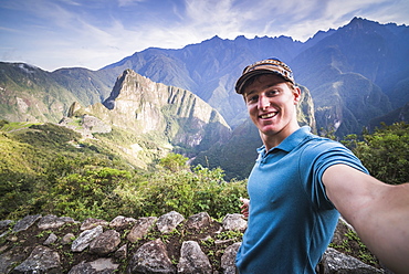 Tourists exploring Machu Picchu Inca Ruins, Cusco Region, Peru, South America