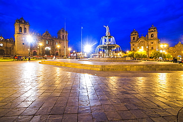 Plaza de Armas Fountain, Cusco Cathedral and Church of the Society of Jesus at night, UNESCO World Heritage Site, Cusco (Cuzco), Cusco Region, Peru, South America