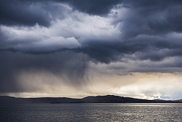 Dramatic storm clouds over Lake Titicaca, Peru, South America