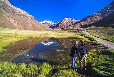 Trekking in Aconcagua Provincial Park with 6961m peak of Aconcagua behind, Andes, Mendoza Province, Argentina, South America