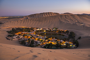 Huacachina, surrounded by sand dunes at night, Ica Region, Peru, South America