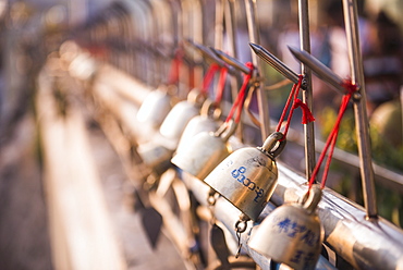 Prayer bells at Golden Rock (Kyaiktiyo Pagoda), Mon State, Myanmar (Burma), Asia