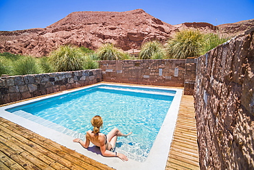 Woman at a swimming pool, Atacama Desert, Chile, South America